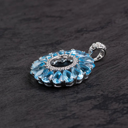 Blue Topaz Halo Circle Silver Pendant – Clarity & Expression